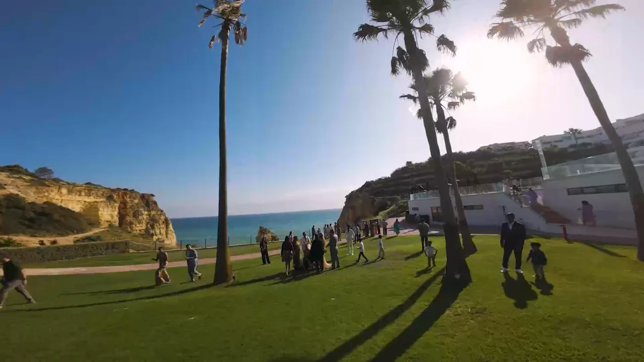 Guests gathering on the lawn above the cliffs at Tivoli Carvoeiro, wedding film by VIP Weddings Films